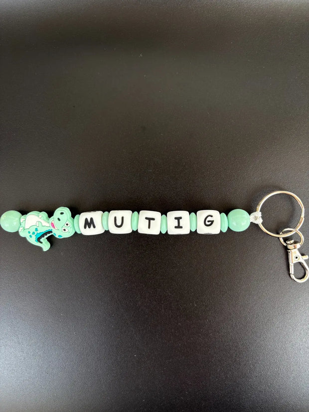 Personalisierter Dino Schlüsselanhänger mit Namen in Mint von BabyLions®