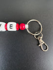 Personalisierter LOVE Schlüsselanhänger mit roten Perlen, Schlüsselring und Karabiner – handgefertigt von BabyLions®