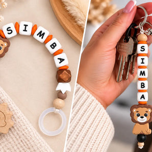 Personalisierte Schnullerkette und Schlüsselanhänger mit Namen von BabyLions
