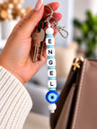 Personalisierter Schlüsselanhänger mit Namen und blauem Glücksauge – handgemacht von BabyLions